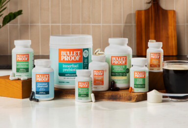 Lineup of Bulletproof supplement bottles in a kitchen setting.