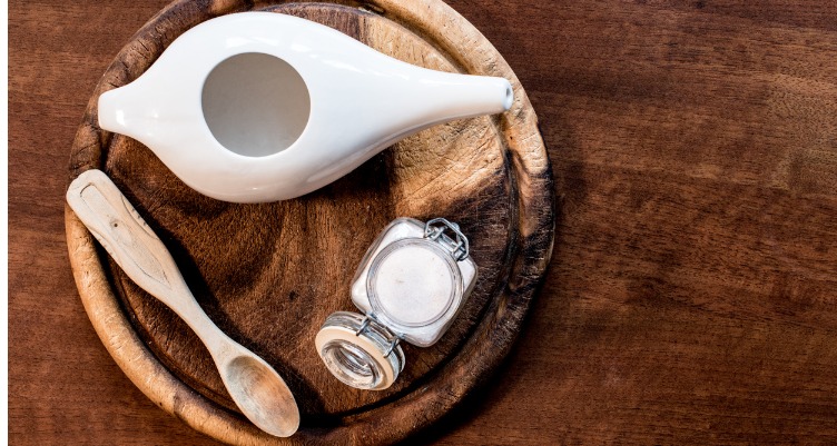 Sinus rinse pot on wooden plate