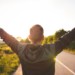 Man raising arms in the air in celebration.