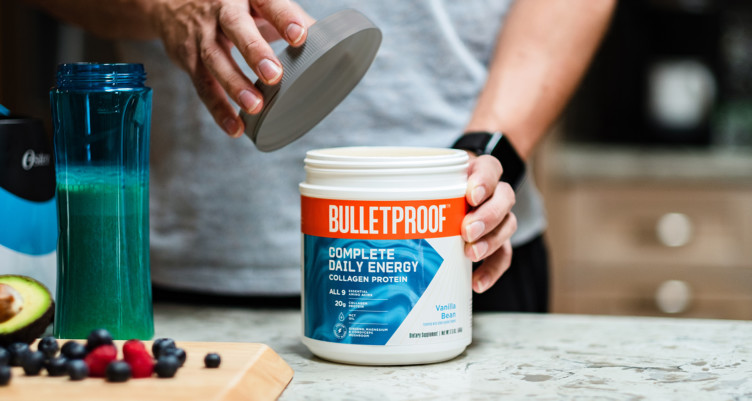 An open tub of Vanilla Bean Complete Daily Energy Collagen Protein