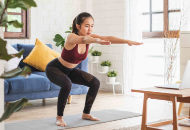 Woman working out from home