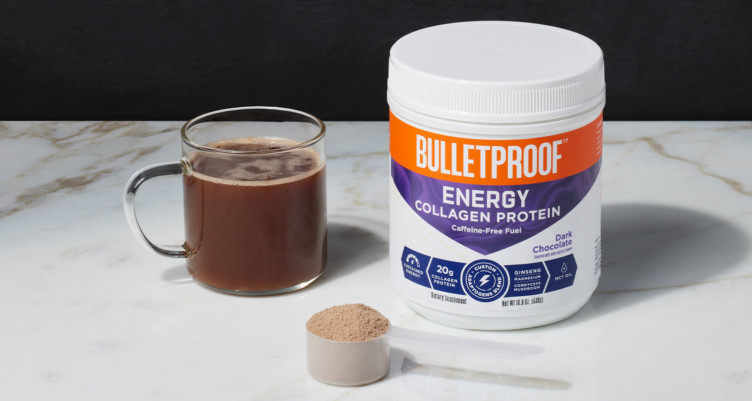 A mug next to a tub of Bulletproof Energy Collagen Protein