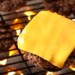 A cheeseburger on the grill