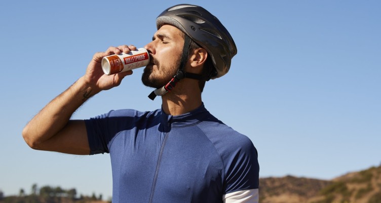 A male cycler drinking Bulletproof Cold Brew Latte