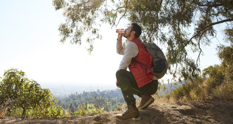 A man drinking Bulletproof Cold Brew Latte on a hike