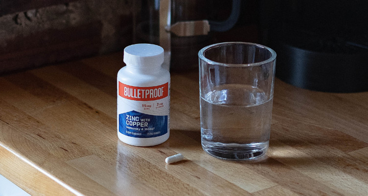 A bottle of Bulletoroof Zinc With Copper