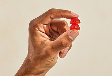 Bulletproof Apple Cider Vinegar Gummies held in someones hand