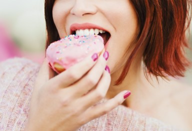 Woman eating donut