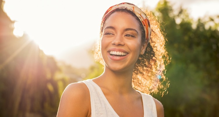 Woman smiling at sunset