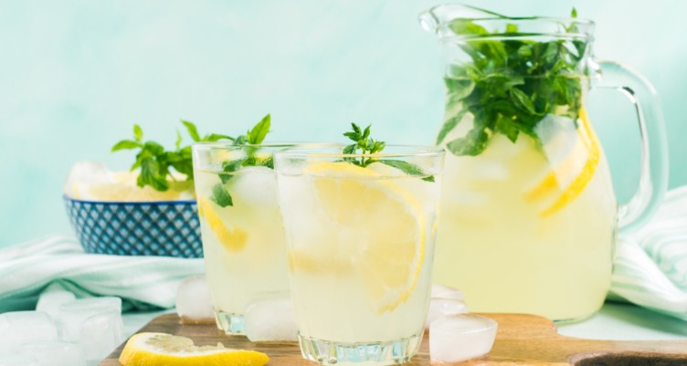 A pitcher and glasses of lemonade
