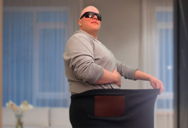 Bulletproof employee Courtland Graham poses in a pair of large pants