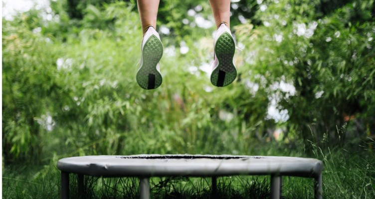 Woman jumping on a trampoline.
