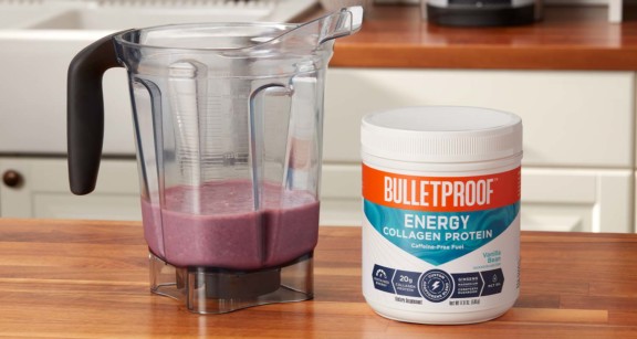 A tub of Bulletproof Complete Daily Energy Collagen Protein and smoothie ingredients