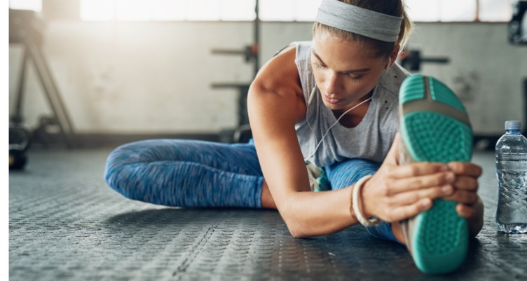 Girl stretching before a workout.