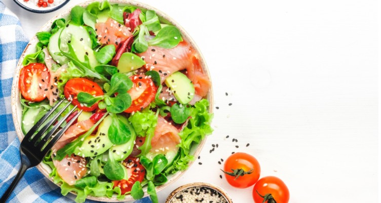 Fresh salmon salad made with avocado and cucumber