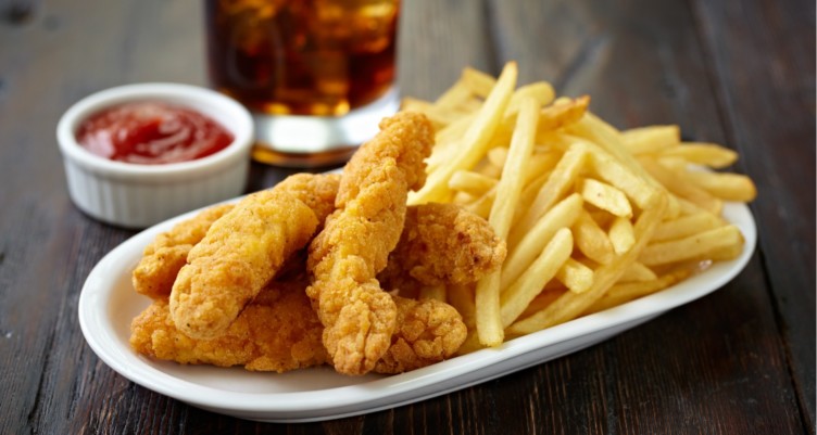Fried chicken strips with fries.