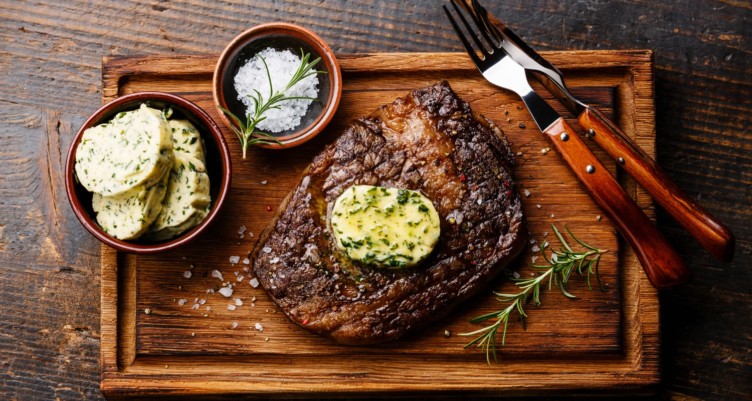 Grilled steak served with herb butter