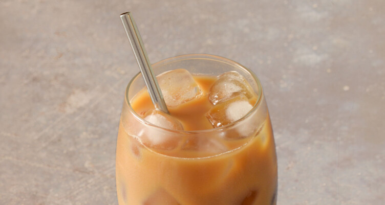 Glass cup filled with iced Bulletproof coffee