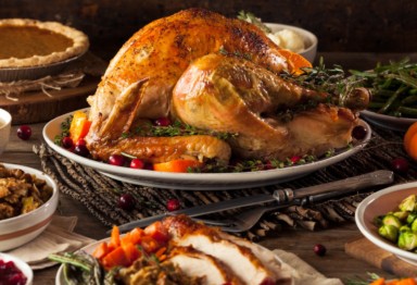 A Thanksgiving turkey and accompanying side dishes