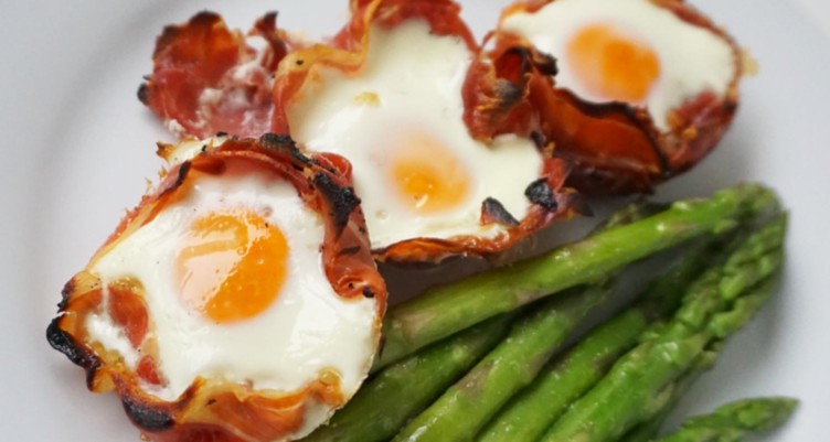 Prosciutto-wrapped baked eggs with asparagus