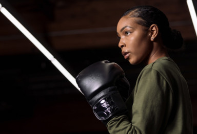 Woman wearing boxing gloves