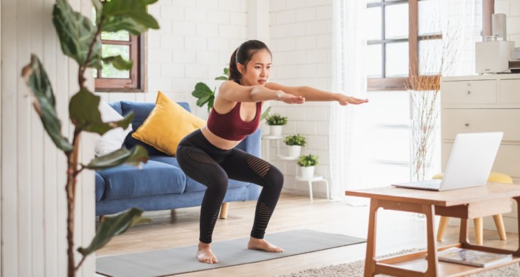 Woman doing yoga at home.
