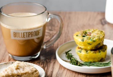 Cup of Bulletproof Coffee next to egg bites