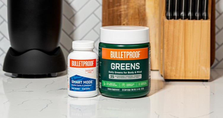 A bottle of Bulletproof Smart Mode and a jar of Bulletproof Greens on a kitchen counter