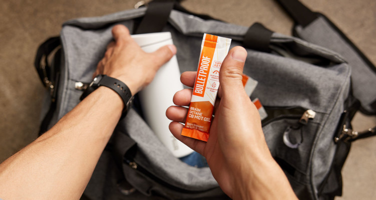 Man holding Bulletproof Brain Octane C8 MCT Oil to-go packet.