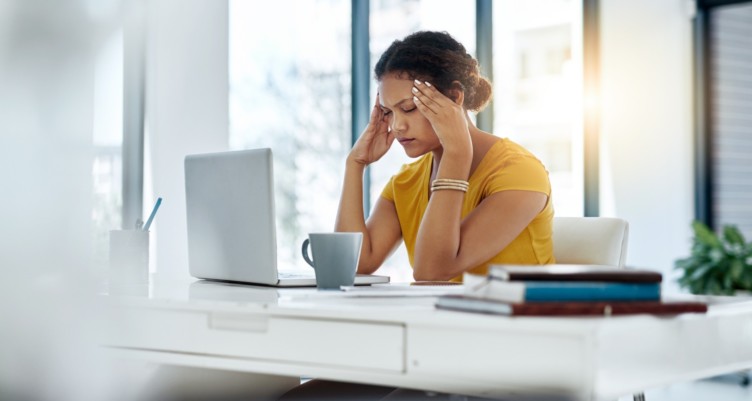 Woman stressed at work.