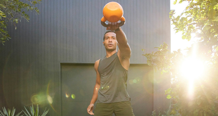 man performing kettlebell swing