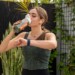Woman drinking Bulletproof Greens before a workout.