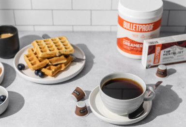 Bulletproof Compostable Espresso Pods with waffles, blueberries and Bulletproof Original Creamer