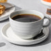 Cup of coffee with waffles and Bulletproof coffee pods.
