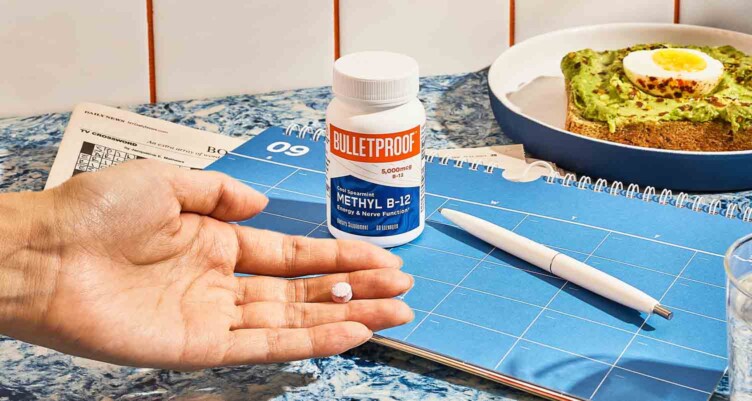 Hand holding serving size of Bulletproof Methyl B-12