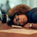 Woman sleeping at her desk