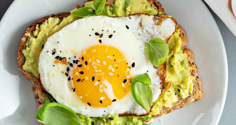 Seasoned egg on top of avocado toast