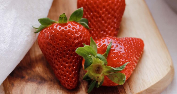 strawberrys sitting on cutting board