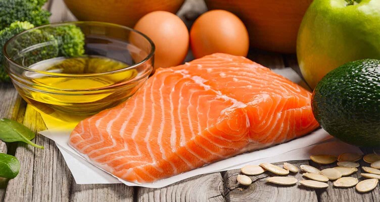 filet of salmon surrounded by produce