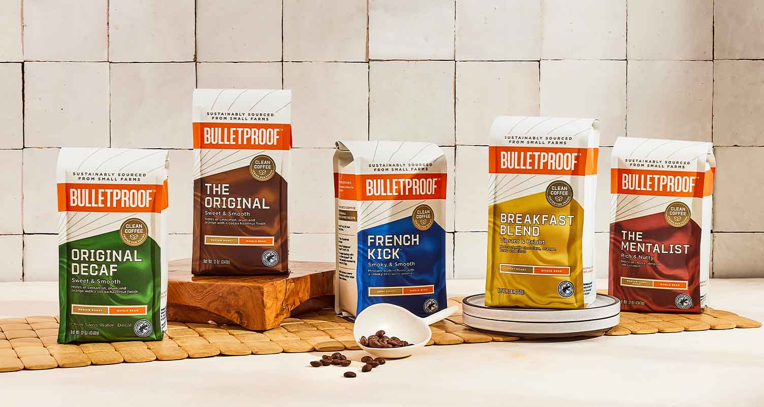 Different Bulletproof coffee roasts displayed on table.