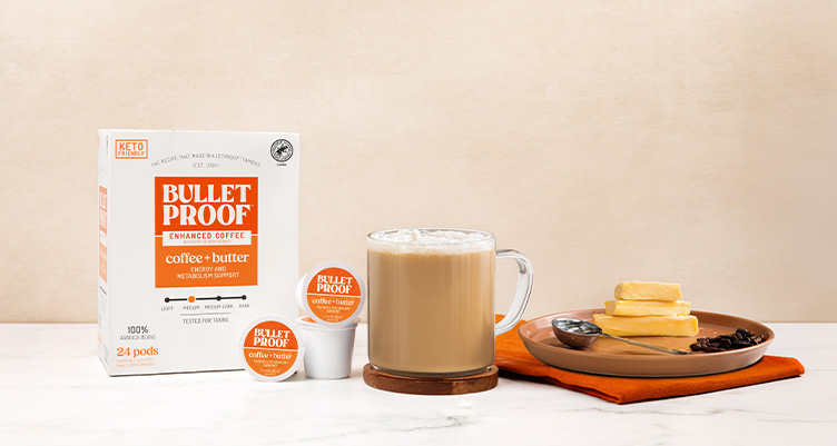 Bulletproof Coffee + Butter pods on kitchen table with mug of coffee