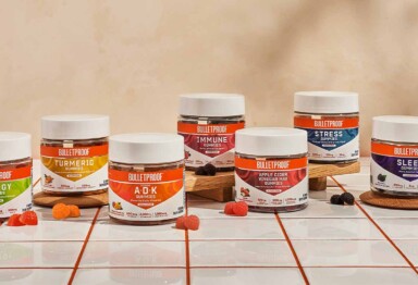 Lineup of the entire Bulletproof Gummy Vitamin family on a tiled tabletop