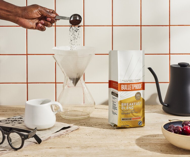 Bulletproof Breakfast blend sitting next to a Chemex coffee maker