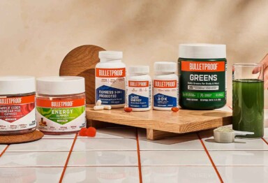 Lineup of various Bulletproof supplements on a tiled counter