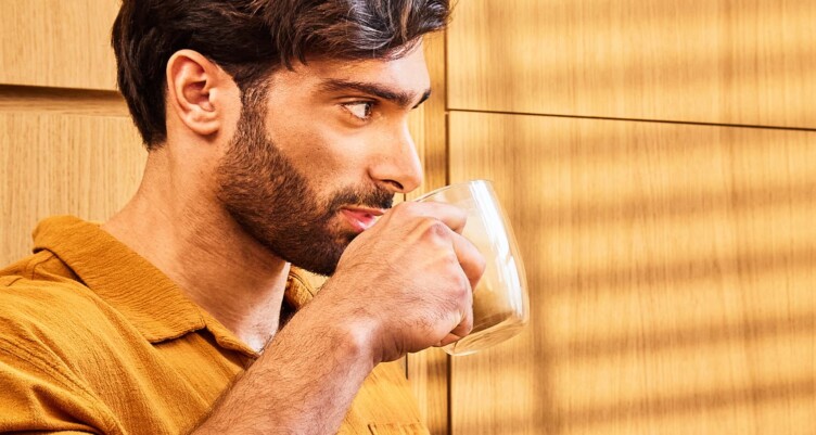 Man drinking a cup of coffee