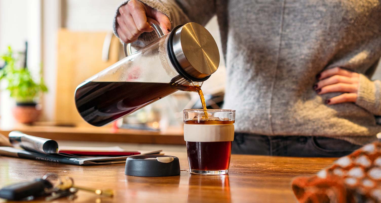 person pouring cold brew
