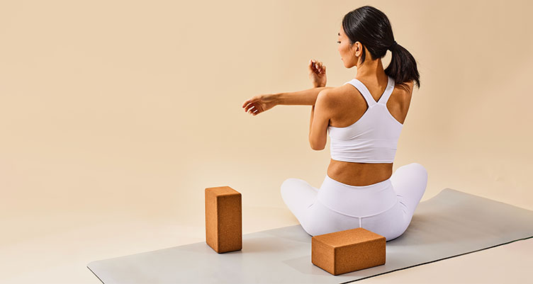 Woman stretching whilst practicing yoga