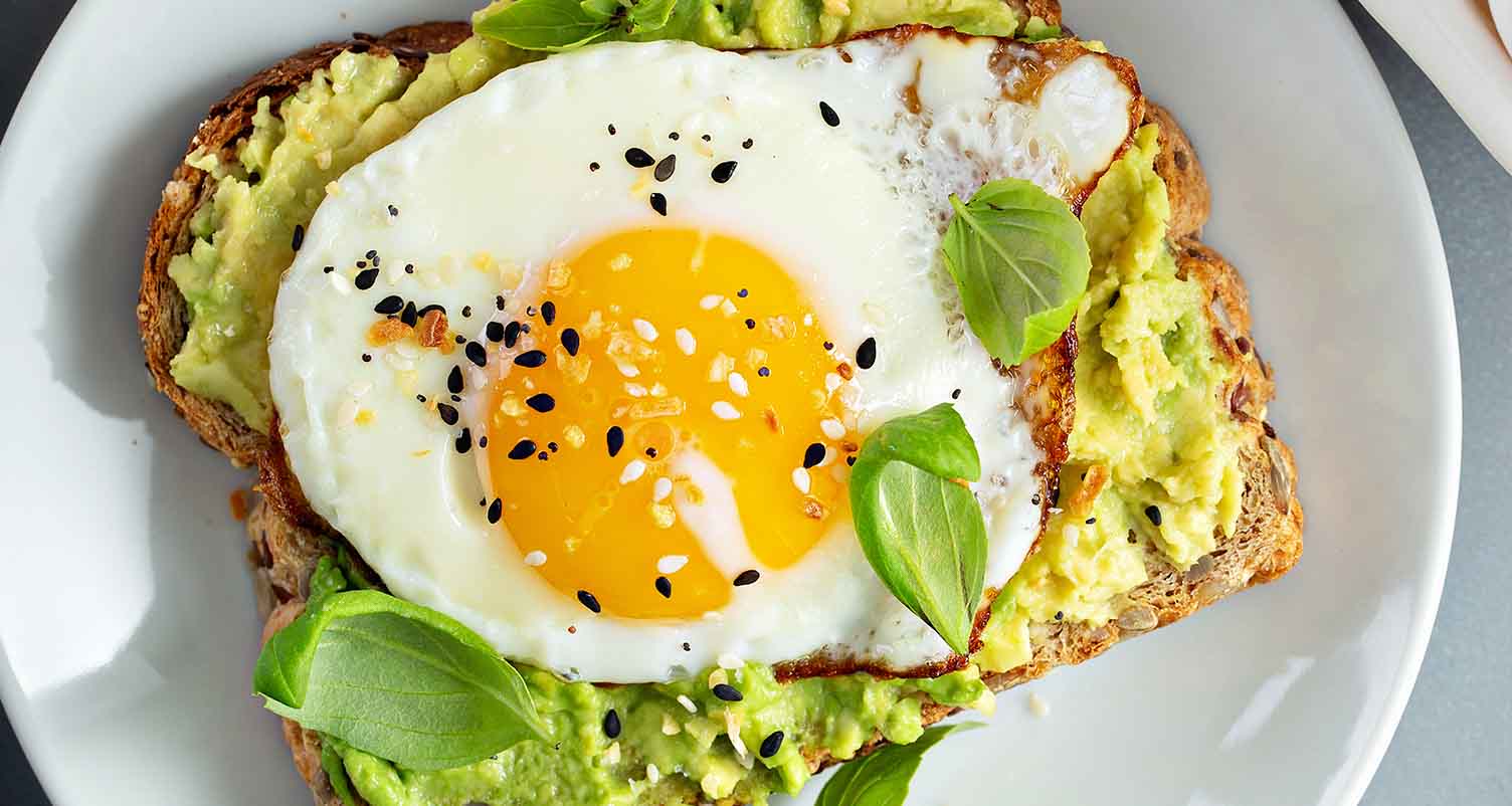 avocado toast with a sunny side up egg