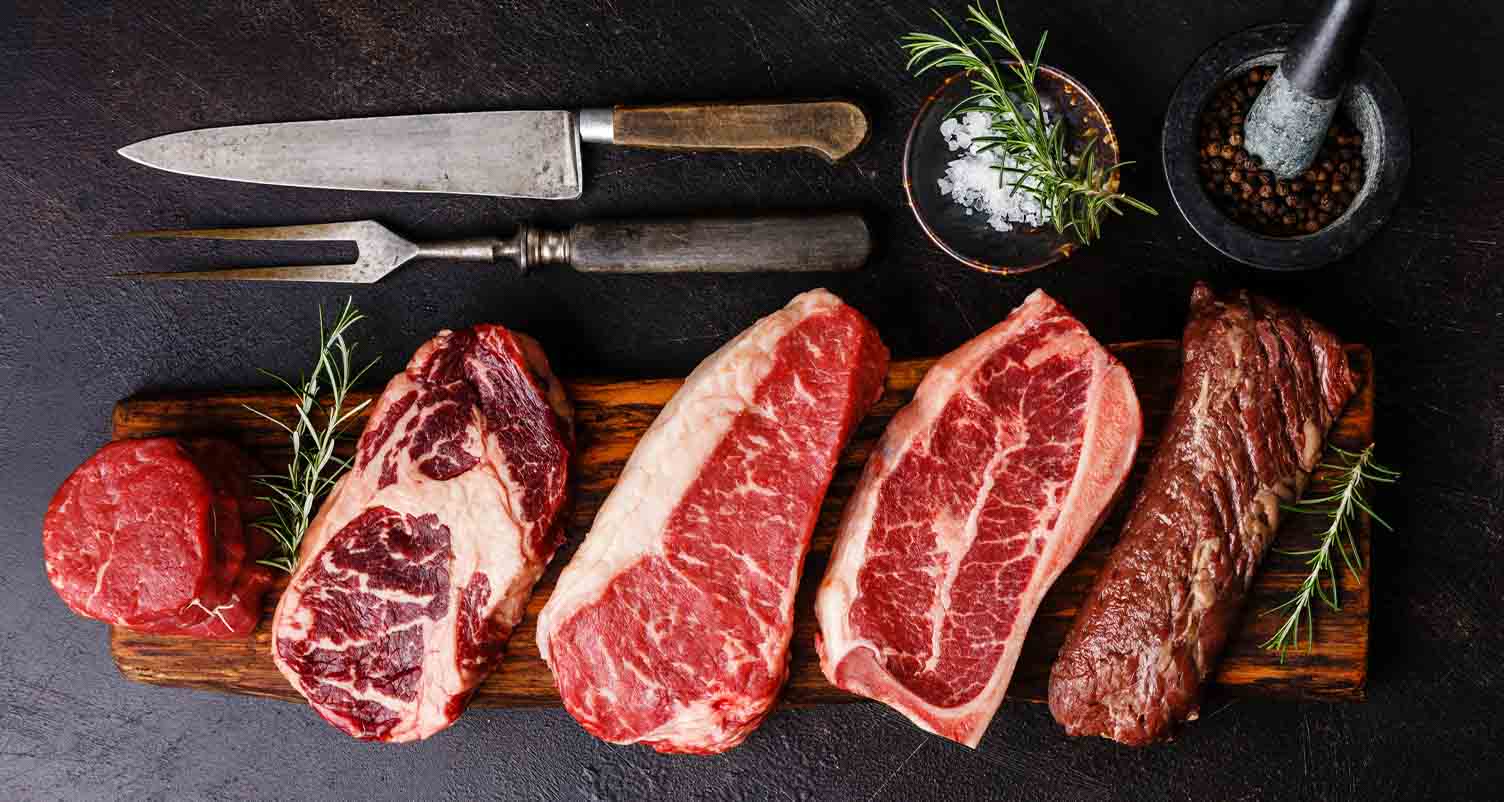 display of raw red meat steaks