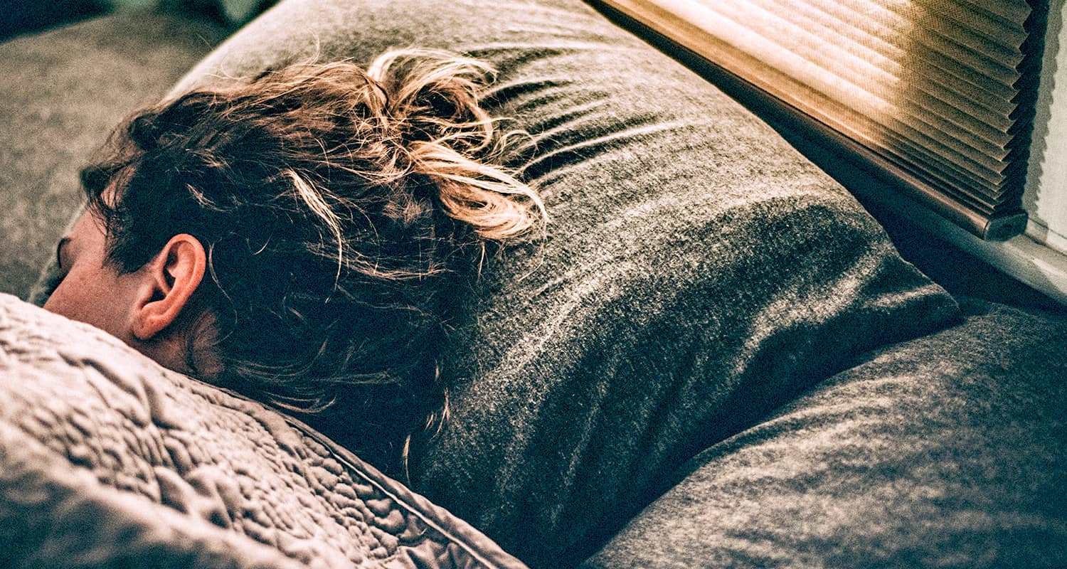 woman sleeping on grey pillow